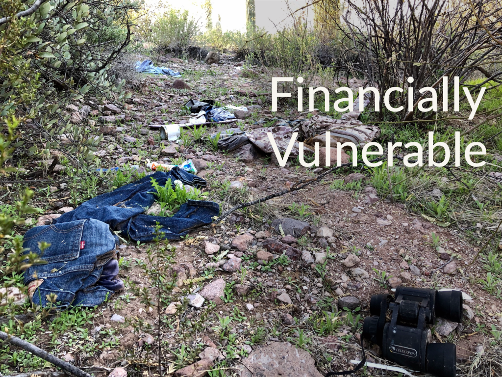 Migrant camp after being caught in Organ Pipe Cactus National Monument. Caption says "Financially Vulnerable." Money Podcast