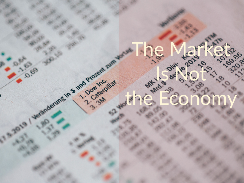 Newspaper listing of stock market prices. Caption says "The Market Is Not the Economy."