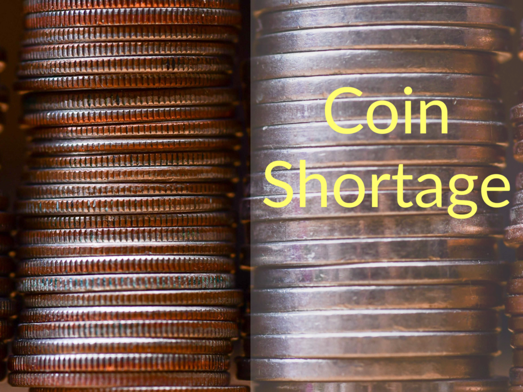 Two stacks of coins. Words say "Coin Shortage."