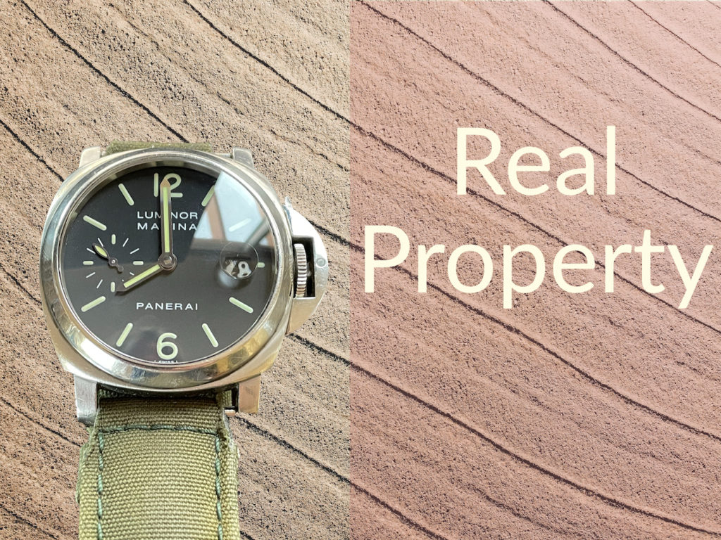 Panerai wrist watch with caption "Real Property"
