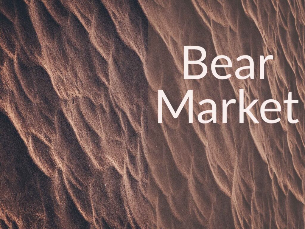 Textured sand with caption "Bear Market"