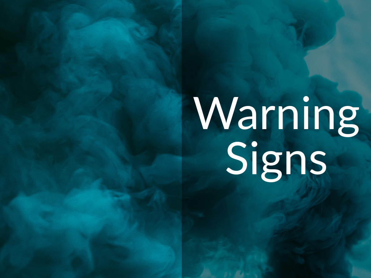 Blue smoke cloud with the caption "Warning Signs"