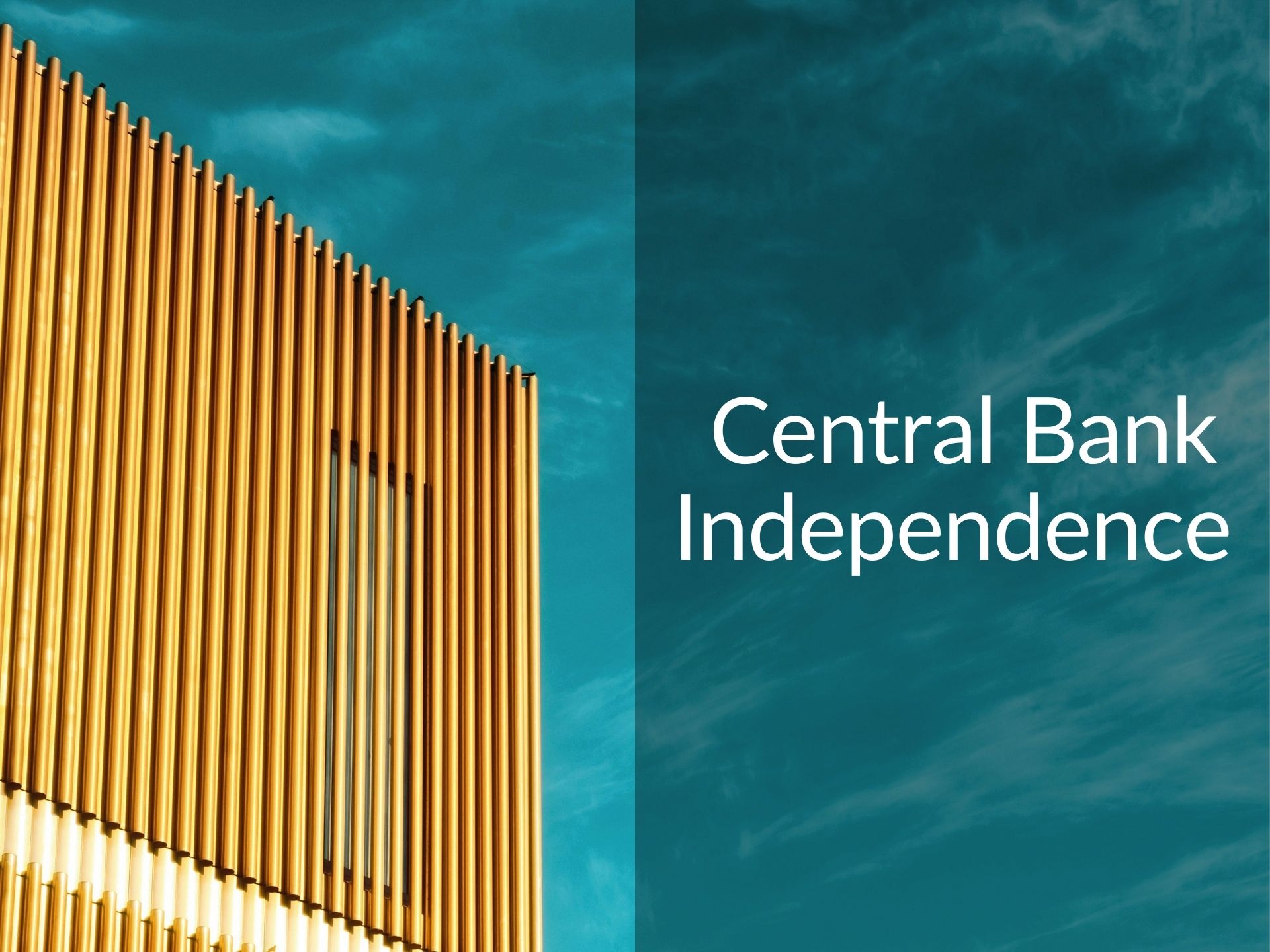 Modern gold colored building with blue sky and the caption " Central Bank Independence"