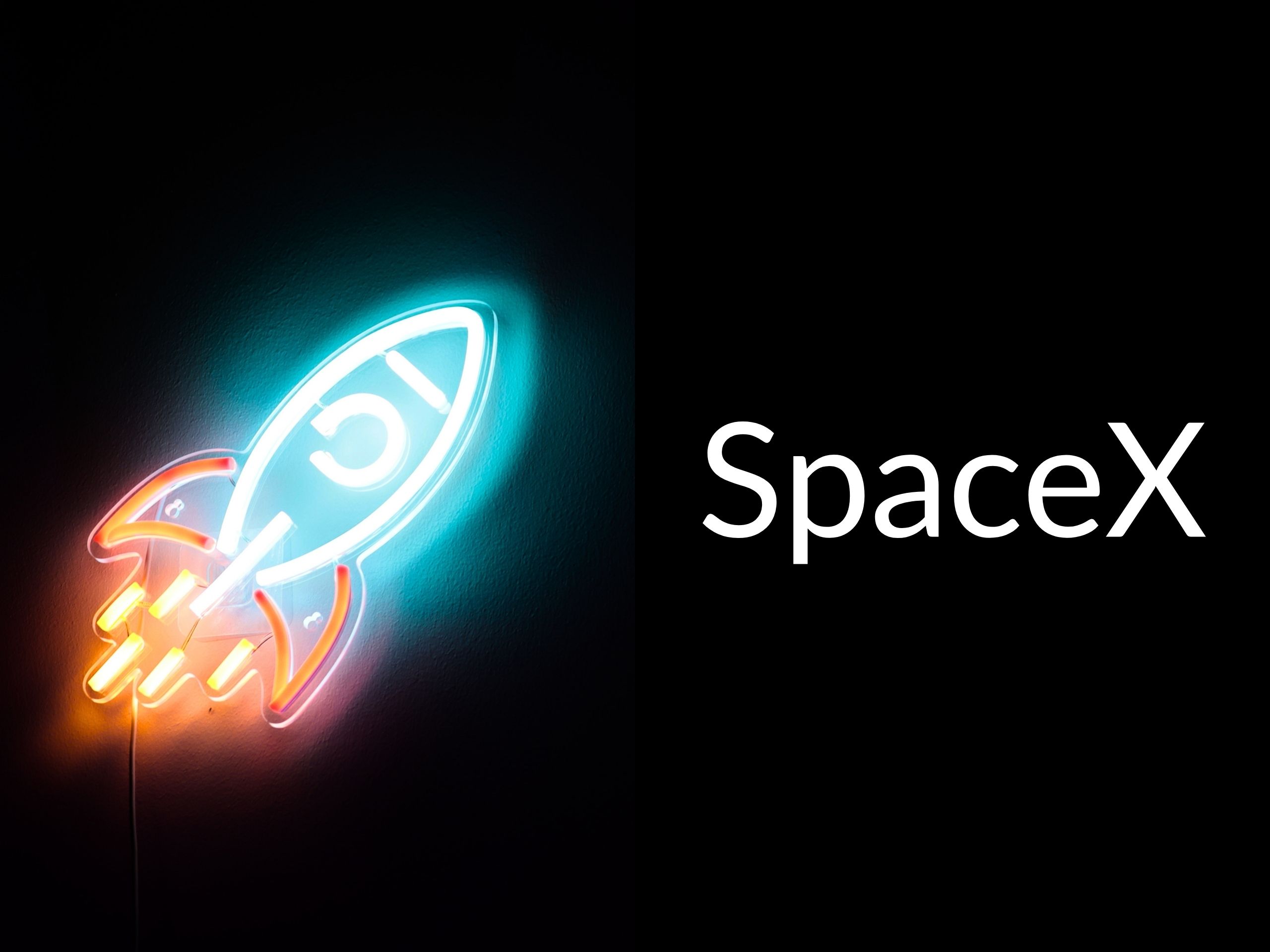 Neon sign rocket with the caption "SpaceX"